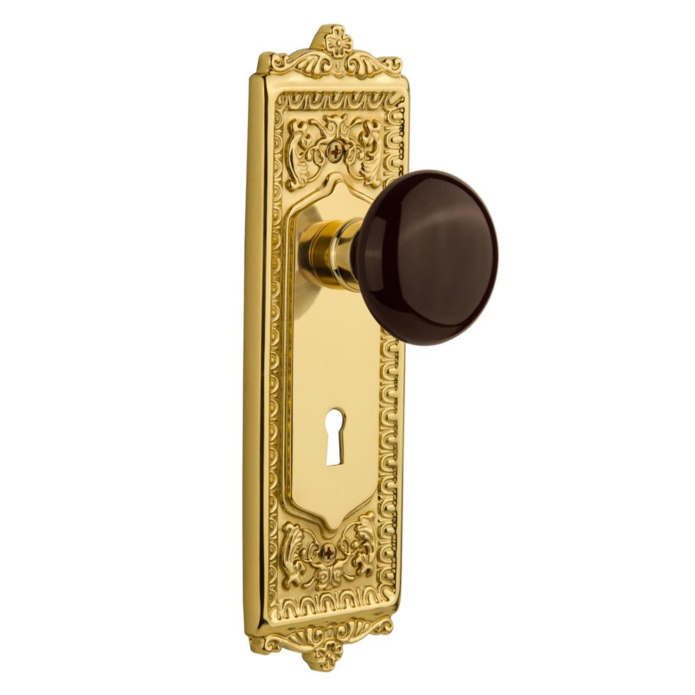 Nostalgic Warehouse EADBRN Double Dummy Knob Egg and Dart Plate with Brown Porcelain Knob and Keyhole in Unlacquered Brass